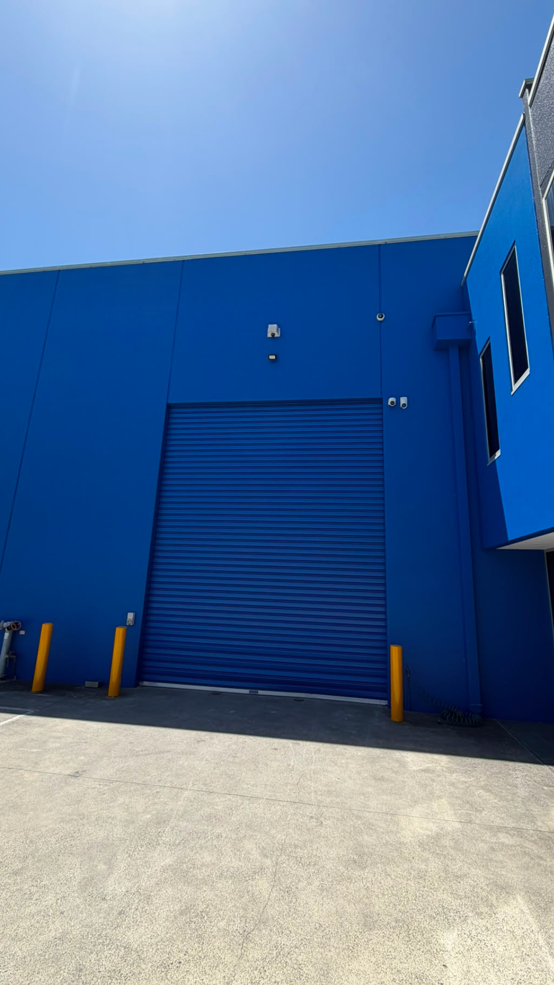 Commercial blue warehouse exterior painting, Melbourne