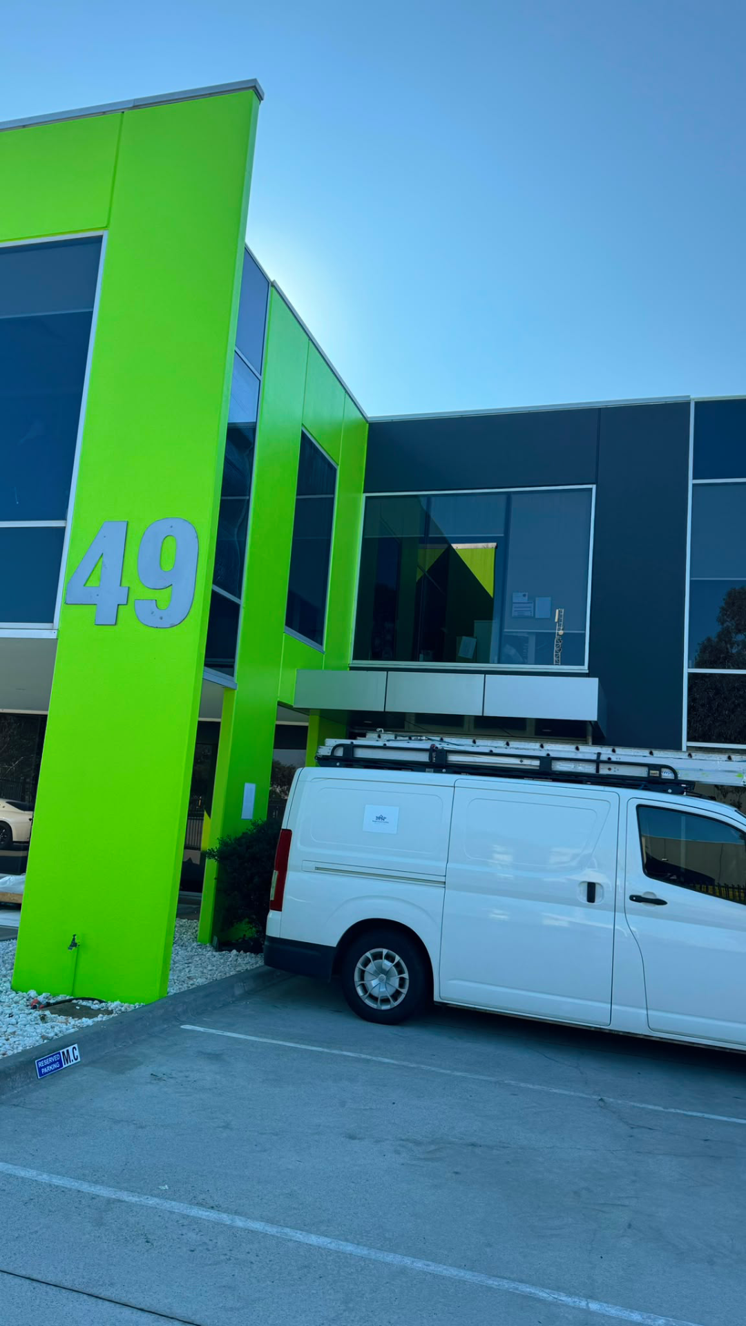 Commercial building exterior painting, green facade, Melbourne