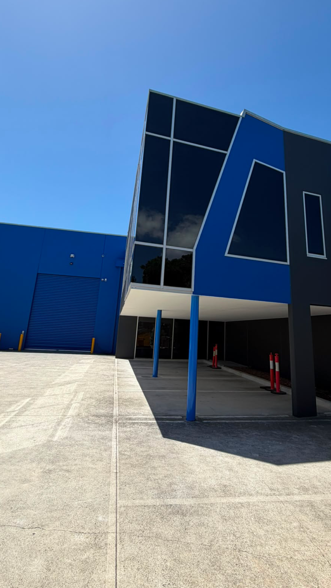 Commercial warehouse blue exterior roller door painting, Melbourne